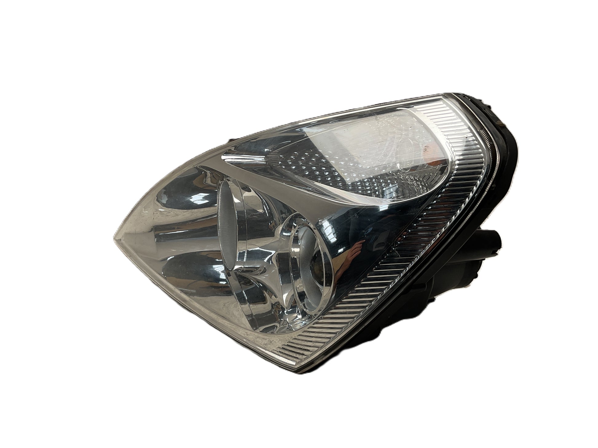 Faro del izq Kia Carnival III 06-15
