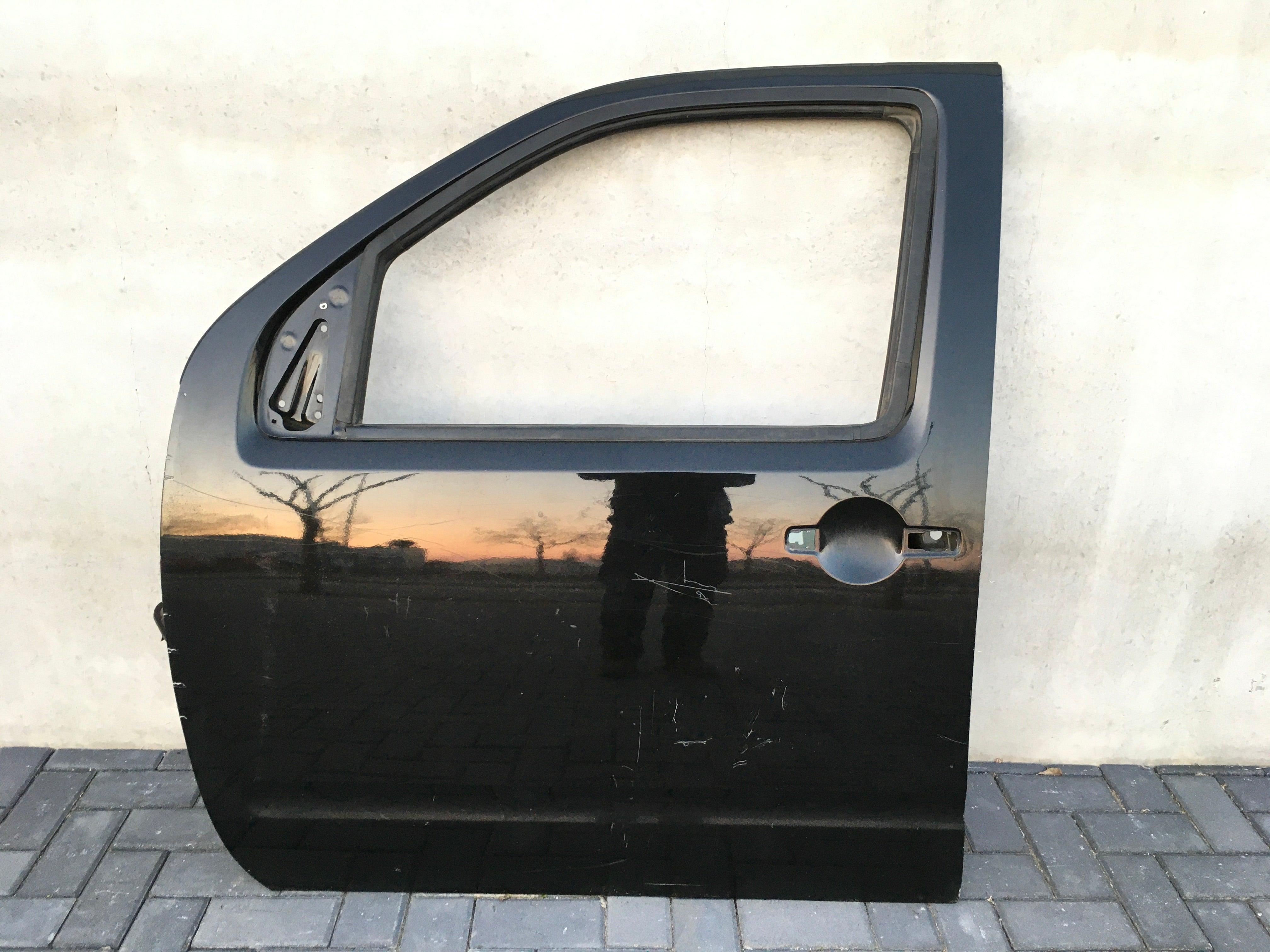 Puerta delantera izq Nissan Navara D40 - AutoRR H01015X0MB