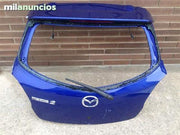 Porton trasero mazda 2 - 