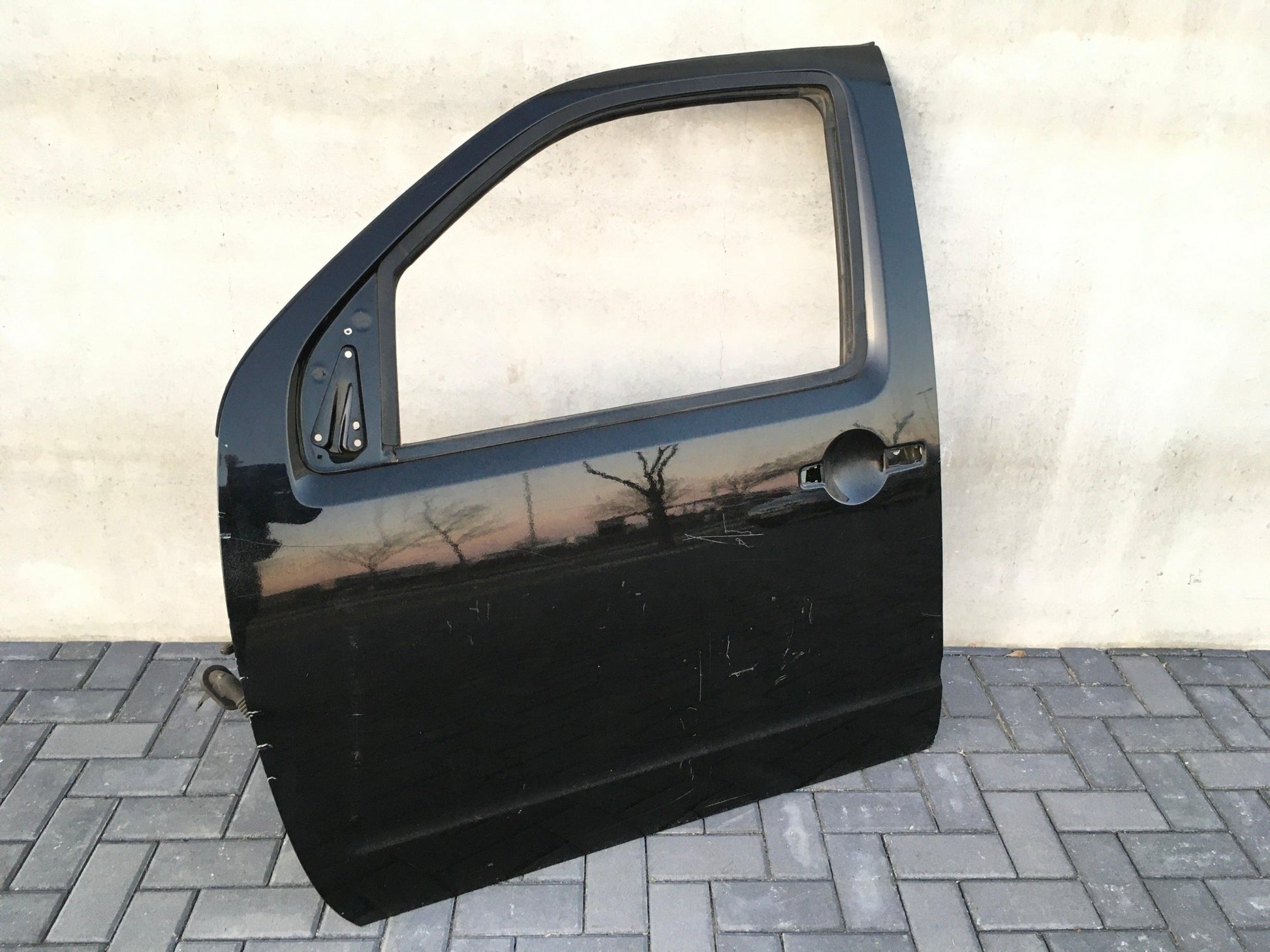 Puerta delantera izq Nissan Navara D40 - H01015X0MB