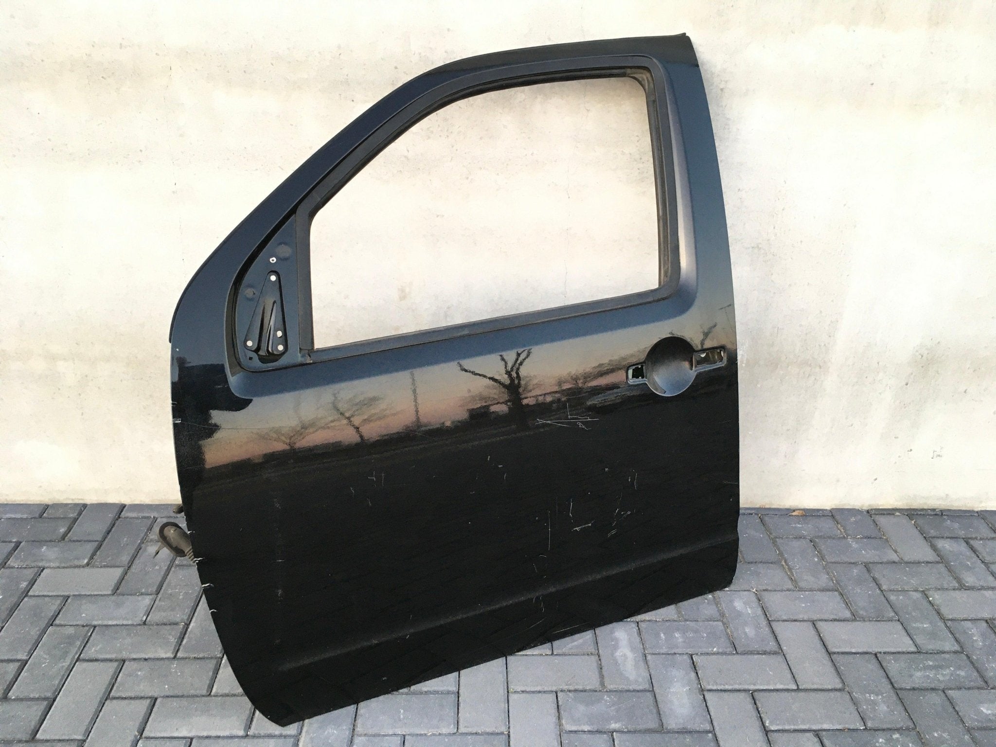 Puerta delantera izq Nissan Navara D40 - H01015X0MB
