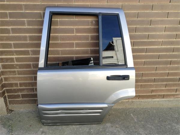 Puerta tras izq jeep grand cherokee i - 